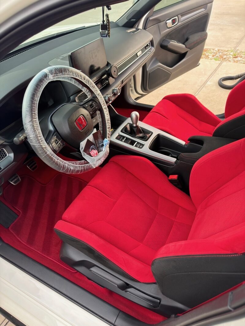 Detailed red leather interior of a Honda Civic Type R