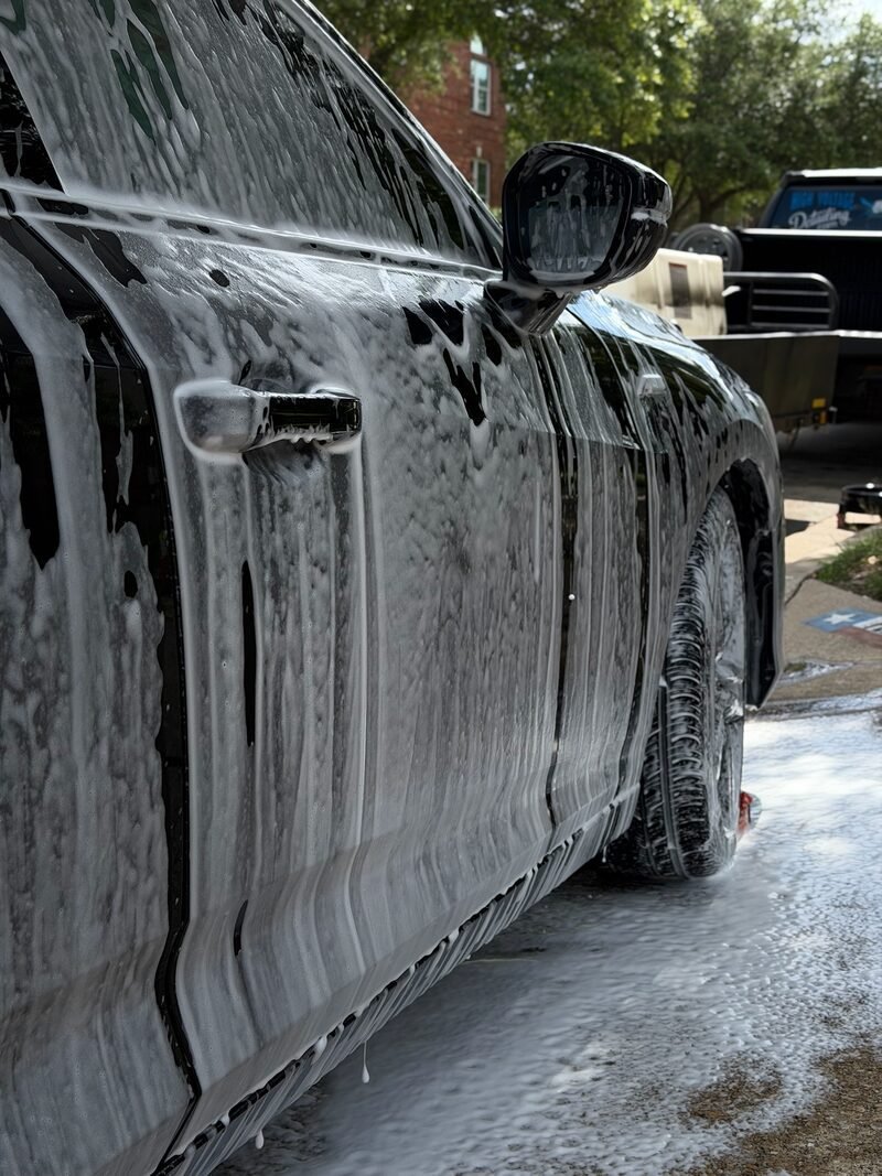 Acura Integra exterior detail in progress with foam wash