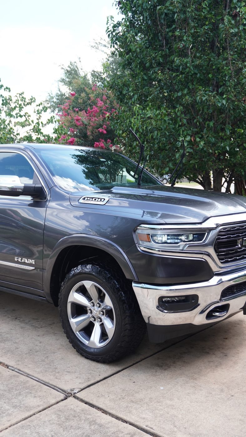 Close-up of RAM 1500 Limited front end after paint enhancement and wheel detail
