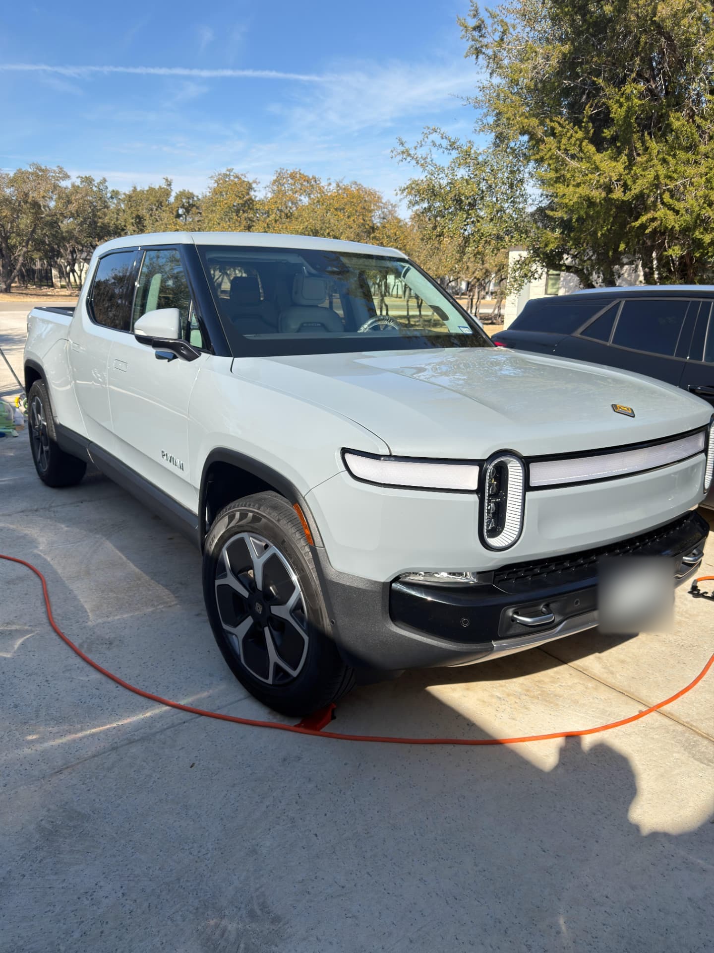 White Rivian after mobile exterior detailing in Central Texas